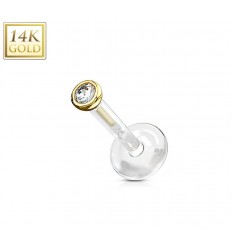 Laget i PTFE med 14 karat gullball med stein