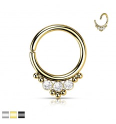 Piercing med 3 steiner og 7 små kuler